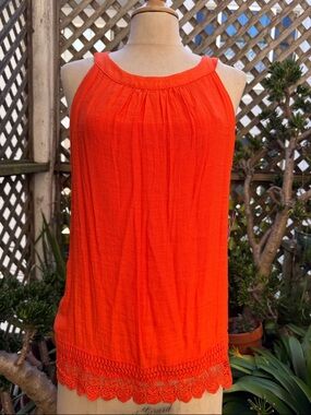 BCX. Halter Top w/crocheted trim.
Size Large. 2 button back closure.
Orange. NWT